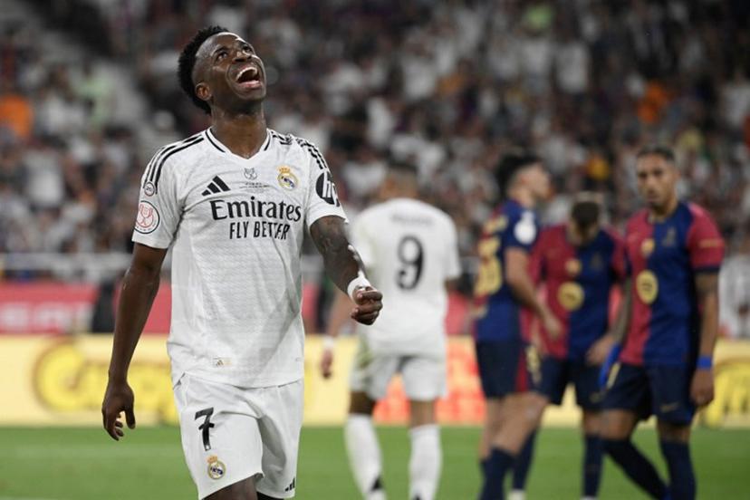Real Madrid's Brazilian forward #07 Vinicius Junior reacts during their Spanish Cup, Copa del Rey (King's Cup) final football match between FC Barcelona and Real Madrid CF at La Cartuja stadium in Seville on April 26, 2025.  Josep LAGO / AFP