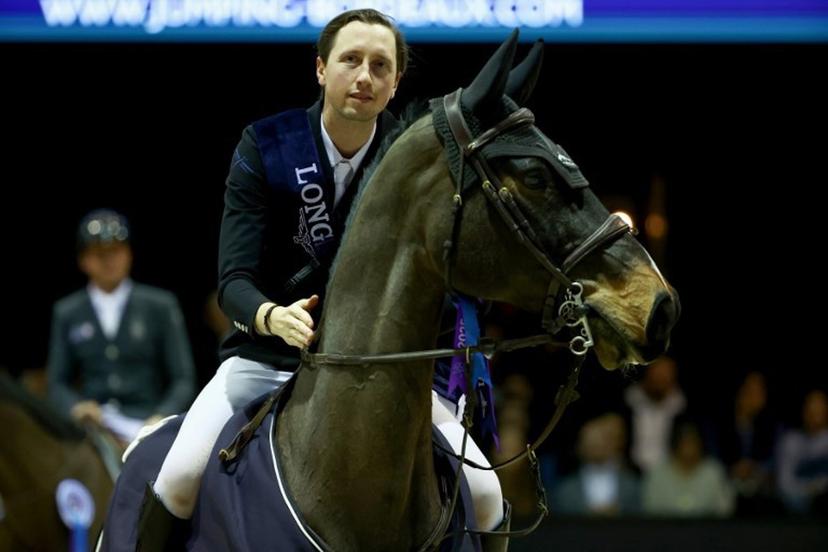 Switzerland' Martin Fuchs riding Connor Jei made poses after the FEI World Cup Jumping event at the Parc des Expositions in Bordeaux, south-western France, on February 8, 2025.   ROMAIN PERROCHEAU / AFP