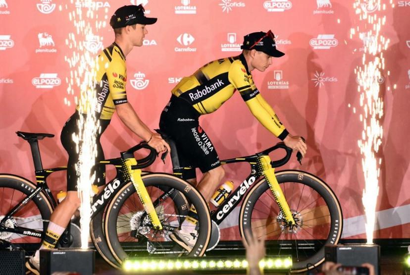 Team Visma-Lease a bike's Danish rider Jonas Vingegaard (R) rides his bike on stage during the official teams presentation of the 80th edition of 'La Vuelta' cycling tour of Spain, in Torino, Italy on August 21, 2025.  Marco BERTORELLO / AFP