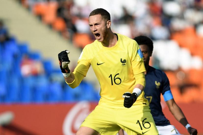 France's goalkeeper Yann François Lienard celebrates after saving a penalty during the Argentina 2023 U-20 World Cup Group F football match between France and Gambia at the Malvinas Argentinas stadium in Mendoza, Argentina, on May 25, 2023.  Andres Larrovere / AFP