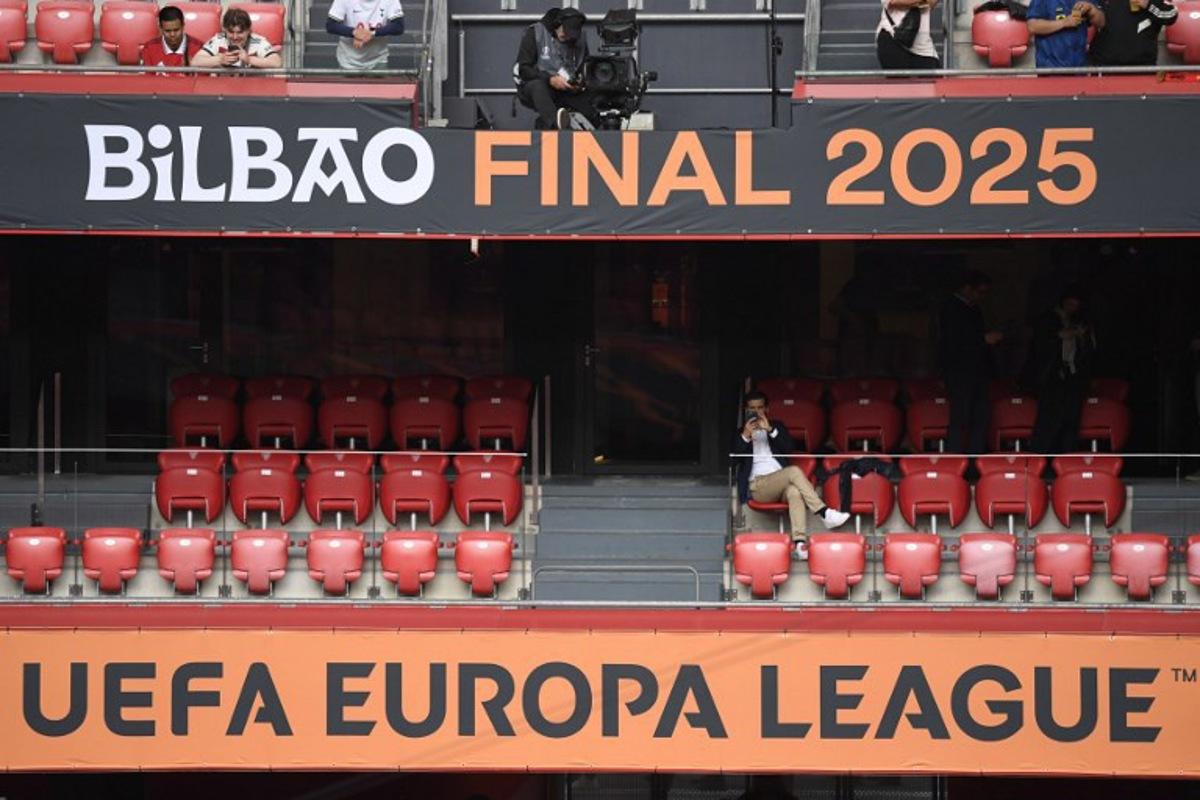 Some early fans take their seats prior to the UEFA Europa League final football match between Tottenham Hotspur and some early Utd fans at San Mames stadium in Bilbao on May 21, 2025.  ANDER GILLENEA / AFP