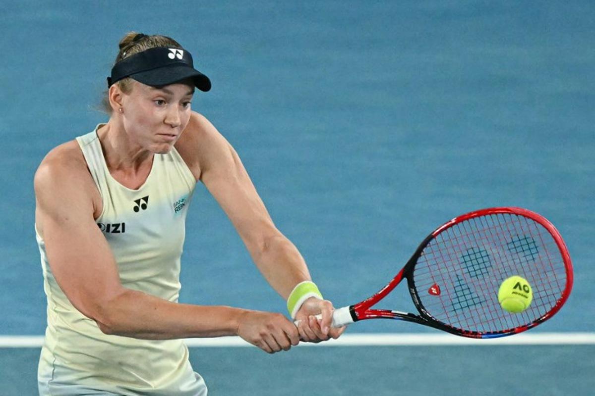 Kazakhstan's Elena Rybakina hits a return against USA's Jessica Pegula during their women's singles semi-final match on day twelve of the Australian Open tennis tournament in Melbourne on January 29, 2026.  WILLIAM WEST / AFP