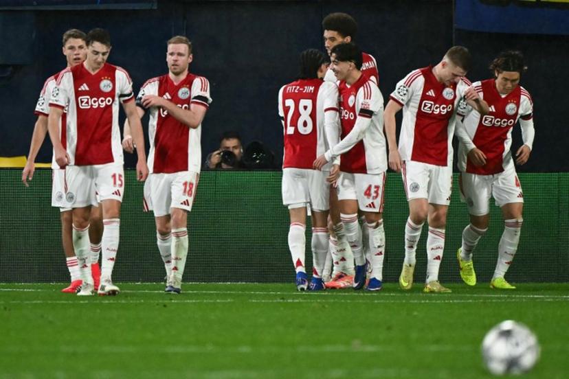 Ajax's Norwegian forward #17 Oliver Edvardsen (behind) celebrates with teammates after scoring his team's second goal during the UEFA Champions League league phase day 7 football match between Villarreal CF and Ajax at La Ceramica Stadium in Vila-real on January 20, 2026.  JOSE JORDAN / AFP