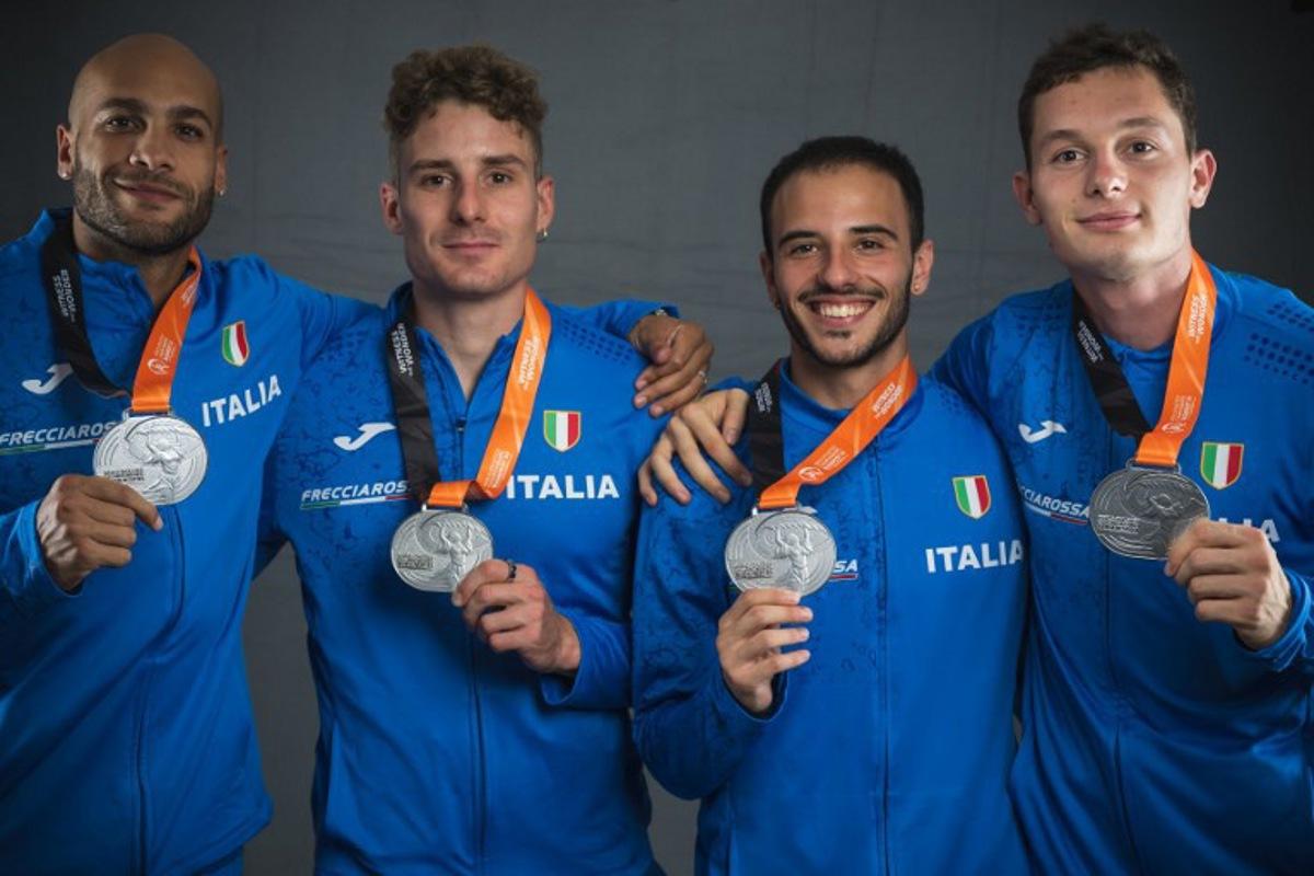 (From L to R) Men's 4x400 relay silver medallists Italy's Lamont Marcell Jacobs, Roberto Rigali, Lorenzo Patta, and Filippo Tortu pose for portraits during a studio photo session on the sidelines of the World Athletics Championships in Budapest on August 27, 2023.  ANDREJ ISAKOVIC / AFP