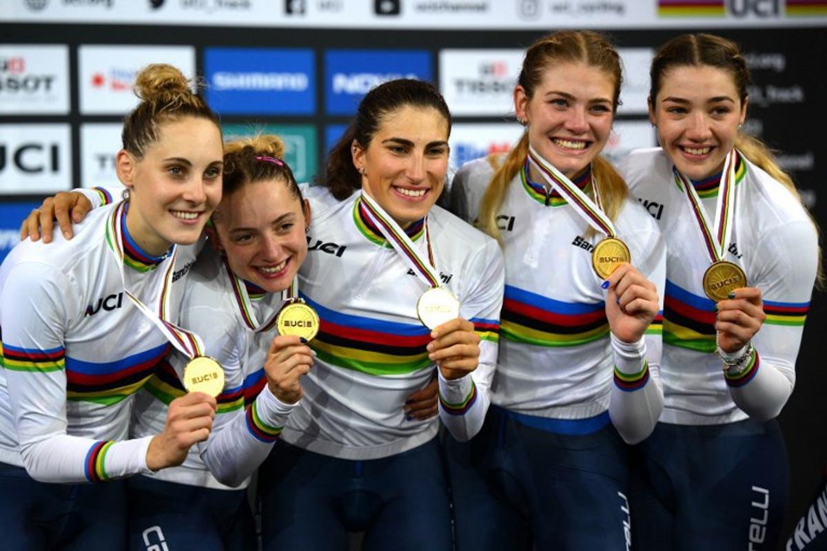 (From L) Italy's Vittoria Guazzini, Italy's Elisa Balsamo, Italy's Chiara Consonni, Italy's Martina Alzini and Italy's Martina Fidanza celebrate with their gold medals on the podium after winning the Women's Team Pursuit finals during the UCI Track Cycling World Championships at the Velodrome of Saint-Quentin-en-Yvelines, southwest of Paris, on October 13, 2022. Anne-Christine POUJOULAT / AFP
