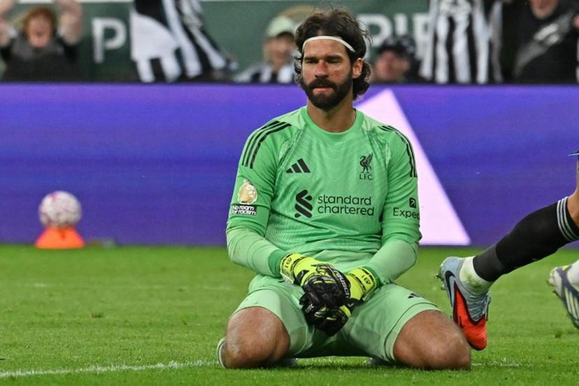 Liverpool's Brazilian goalkeeper #01 Alisson Becker reacts after conceding their second goal during the English Premier League football match between Newcastle United and Liverpool at St James' Park in Newcastle-upon-Tyne, north east England on August 25, 2025.  ANDY BUCHANAN / AFP