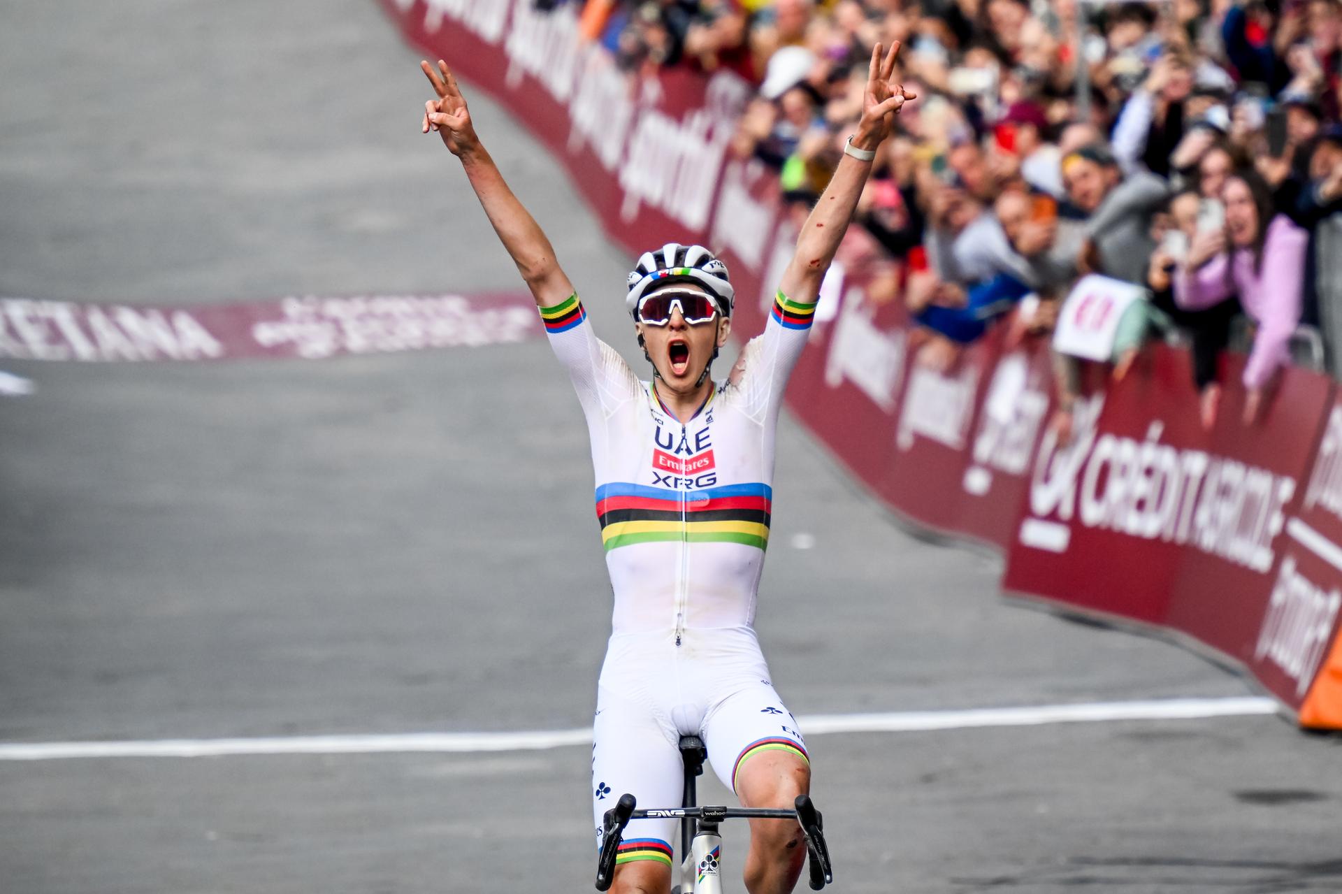 Slovenian Tadej Pogacar of UAE Team Emirates celebrates as he crosses the finish line to win the men elite 'Strade Bianche' one day cycling race, 213km from and to Siena, Italy on Saturday 08 March 2025. BELGA PHOTO DIRK WAEM
