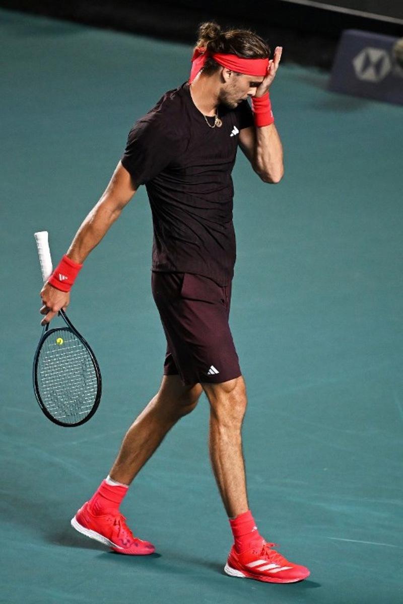 Germany's Alexander Zverev reacts after losing a point against USA's Lerner Tien during their 2025 Mexico ATP Open 500 men´s singles tennis match at the Arena GNP Seguros in Acapulco, Guerrero State, Mexico on February 26, 2025.  CARL DE SOUZA / AFP