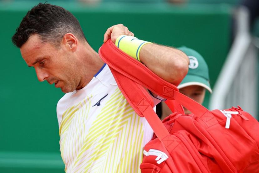 Spain's Roberto Bautista Agut leaves the court to retire after playing against Italy's Matteo Berrettini during the Monte Carlo ATP Masters Series Tournament round of 64 tennis match on Court Rainier III at the Monte-Carlo Country Club in Roquebrune-Cap-Martin, south-eastern France on April 7, 2026.  Valery HACHE / AFP