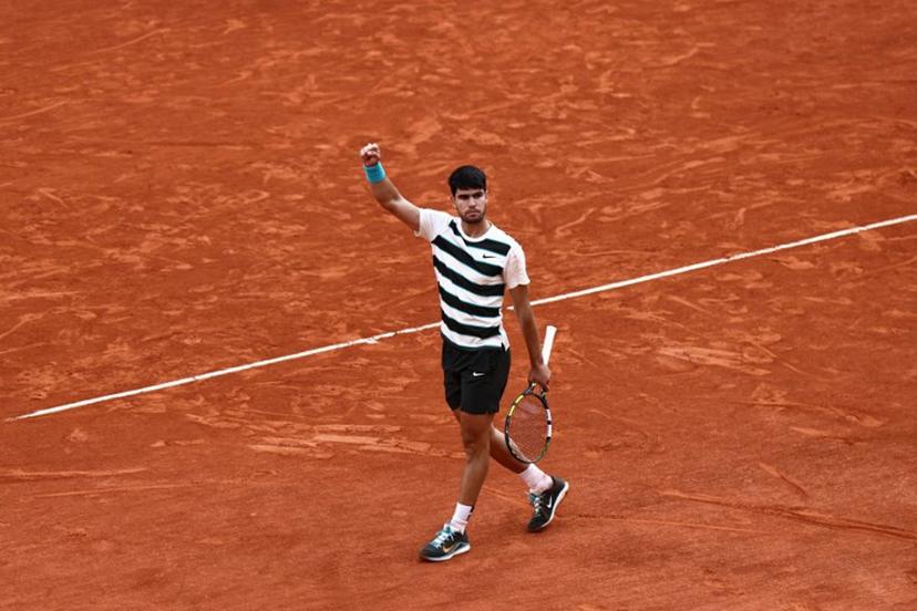 Spain's Carlos Alcaraz reacts after a point during his men's singles final match against Italy's Jannik Sinner on day 15 of the French Open tennis tournament on Court Philippe-Chatrier at the Roland-Garros Complex in Paris on June 8, 2025.  Thibaud MORITZ / AFP
