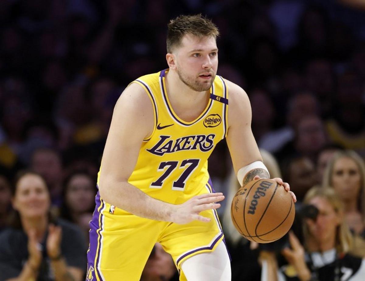 Luka Doncic #77 of the Los Angeles Lakers dribbles during a 103-96 loss to the Minnesota Timberwolves in Game Five of the Western Conference First Round NBA Playoffs at Crypto.com Arena on April 30, 2025 in Los Angeles, California. NOTE TO USER: User expressly acknowledges and agrees that, by downloading and or using this photograph, User is consenting to the terms and conditions of the Getty Images License Agreement. Doncic has signed a new long-term contract extension with the Los Angeles Lakers, the club announced on August 2, 2025, in a deal reportedly worth $165 million over three years. The Slovenian star, who joined the Lakers in a jaw-dropping trade earlier this year, will remain with the Lakers for the next three years through to 2028.  Harry How / GETTY IMAGES NORTH AMERICA / AFP