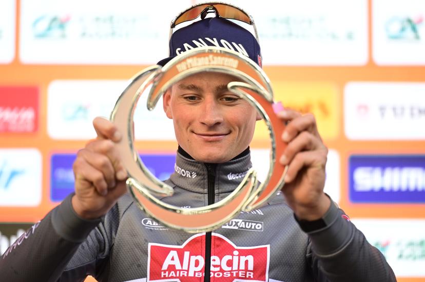 Dutch Mathieu van der Poel of Alpecin-Deceuninck celebrates on the podium with the trophy after winning the 'Milano-Sanremo' one day cycling race for men, 289km from Milan to Sanremo, Italy, Saturday 22 March 2025. BELGA PHOTO DIRK WAEM