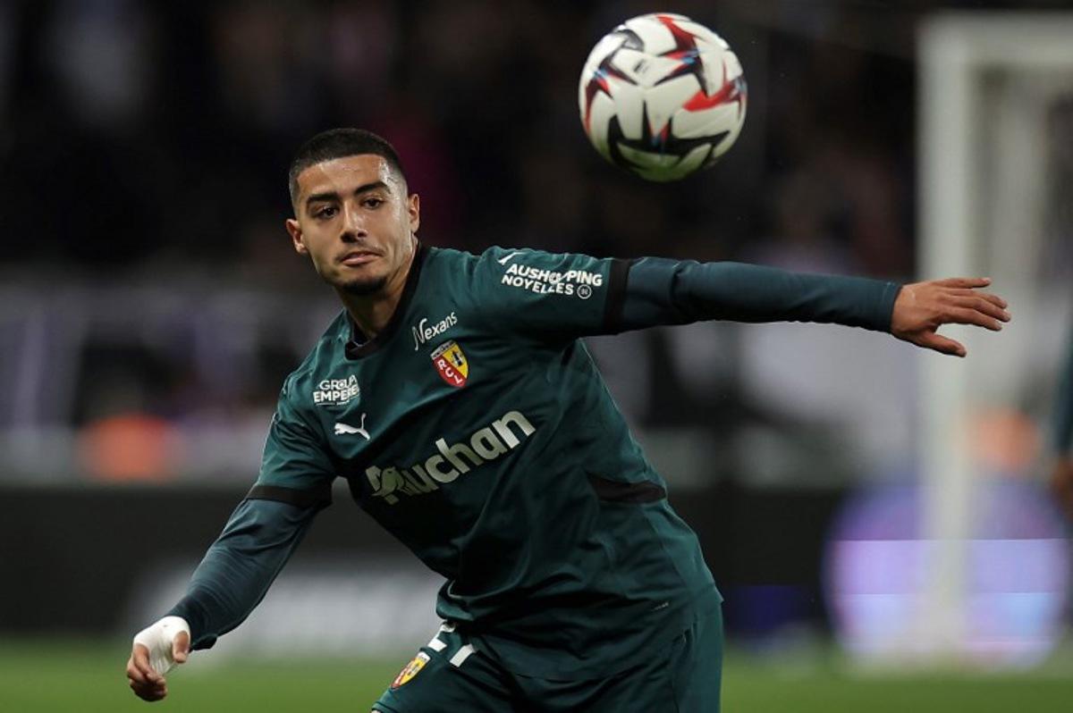 Lens' Moroccan forward #21 Anass Zaroury eyes the ball during the French L1 football match between Toulouse FC and RC Lens at The TFC Stadium in Toulouse, southwestern France, on May 10, 2025.  Valentine CHAPUIS / AFP