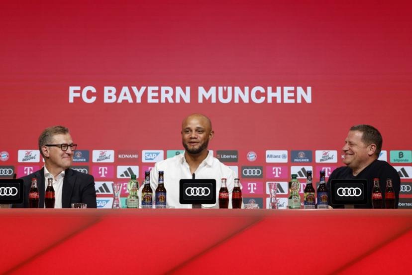 (L-R) Bayern Munich's CEO Jan-Christian Dreesen, the club's new head coach Vincent Kompany and the director of sport Max Eberl give a press conference during Kompany's official presentation as new coach of German Bundesliga first division football team FC Bayern Munich on May 30, 2024 in Munich, southern Germany. Bayern Munich's long search to fill their vacant head coaching position is over with the German giants naming Vincent Kompany as manager in a shock move. The 38-year-old Belgian, a surprise choice with his Burnley side relegated from the Premier League this season, has penned a three-year deal with the German record club. Michaela STACHE / AFP
