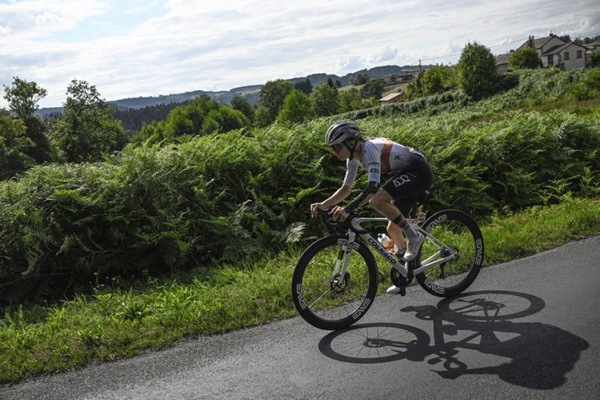 UAE Team ADQ's French rider Maeva Squiban leads during the 6th stage (out of 9) of the fourth edition of the Women's Tour de France cycling race, 123.7 km from Clermont-Ferrand to Ambert, central France on July 31, 2025.  JULIEN DE ROSA / AFP