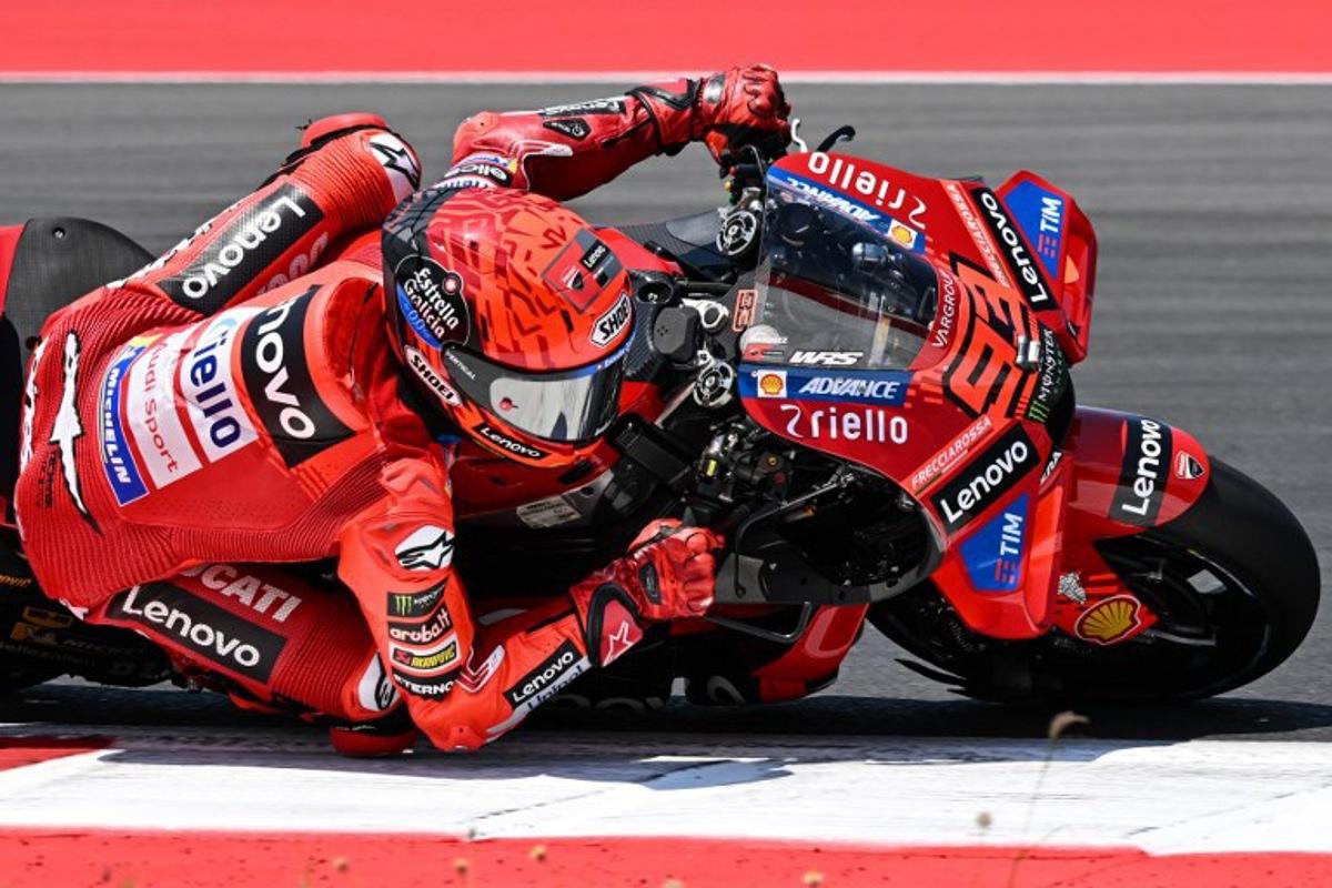 Ducati Lenovo Team's Spanish MotoGP rider Marc Marquez rides during the warm-up ahead of the MotoGP Indonesian Grand Prix at the Mandalika International Circuit in Mandalika, West Nusa Tenggara on October 5, 2025.  SONNY TUMBELAKA / AFP