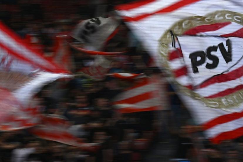 PSV Eindhoven's supporters wave flags during the UEFA Europa League football 1st round day 3 group A match between FC Zurich and PSV Eindhoven at Letzigrund stadium in Zurich on October 6, 2022.  SEBASTIEN BOZON / AFP
