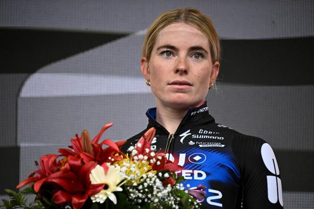 Second-placed FDJ-SUEZ team's Dutch rider Demi Vollering celebrates on the podium for the fourth edition of the Women's Tour de France cycling race at the end of the 9th and final stage (out of 9) 124.1 km from Praz-sur-Arly to Chatel, in Chatel, eastern France on August 3, 2025.  JULIEN DE ROSA / AFP