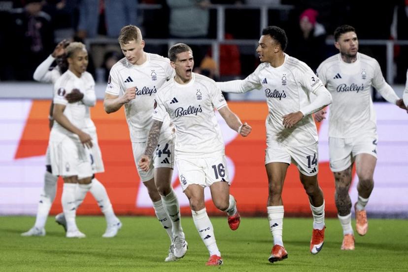 Nottingham Forest's Argentine midfielder #16 Nicolas Dominguez (C) is celebrated by team mates after scoring the 0-1 goal during the UEFA Europa League football match, last 16 second leg, between FC Midtjylland and Nottingham Forest in Herning, Denmark on March 19, 2026.  Bo Amstrup / Ritzau Scanpix / AFP