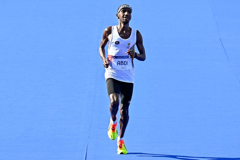 Belgian athlete Bashir Abdi crosses the finish line to win the silver medal of the men's marathon of the athletics competition at the Paris 2024 Olympic Games, on Saturday 10 August 2024 in Paris, France. The Games of the XXXIII Olympiad are taking place in Paris from 26 July to 11 August. The Belgian delegation counts 165 athletes competing in 21 sports. BELGA PHOTO JASPER JACOBS