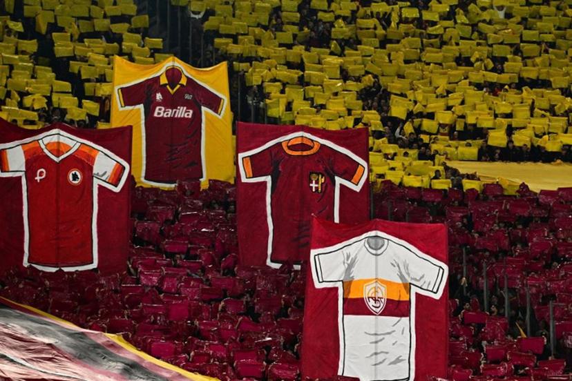 AS Roma's supporters take part in the pre-match show before the Italian Serie A football match between Lazio and Roma at the Olympic Stadium in Rome on April 13, 2025.  Tiziana FABI / AFP