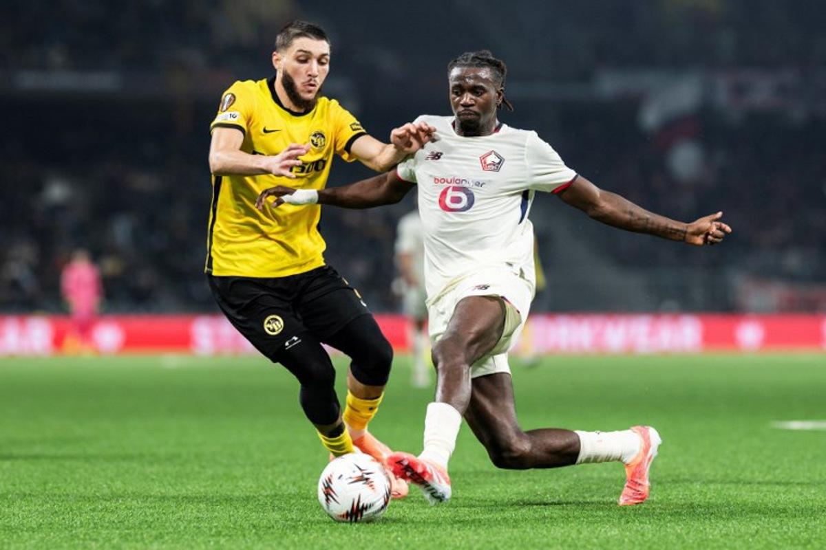 Young Boys' Algerian defender #3 Jaouen Hadjam (L) fights for the ball with Lille's Congolese midfielder #17 Ngal'Ayel Mukau (R) during the UEFA Europa League, league phase, football match between Young Boys and Lille LOSC at the Wankdorf stadium, in Bern, on December 11, 2025.  ENNIO LEANZA / AFP
