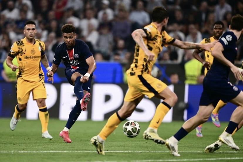 Paris Saint-Germain's French midfielder #14 Desire Doue shoots during the UEFA Champions League final football match between Paris Saint-Germain (PSG) and Inter Milan in Munich, southern Germany on May 31, 2025.   Marco BERTORELLO / AFP