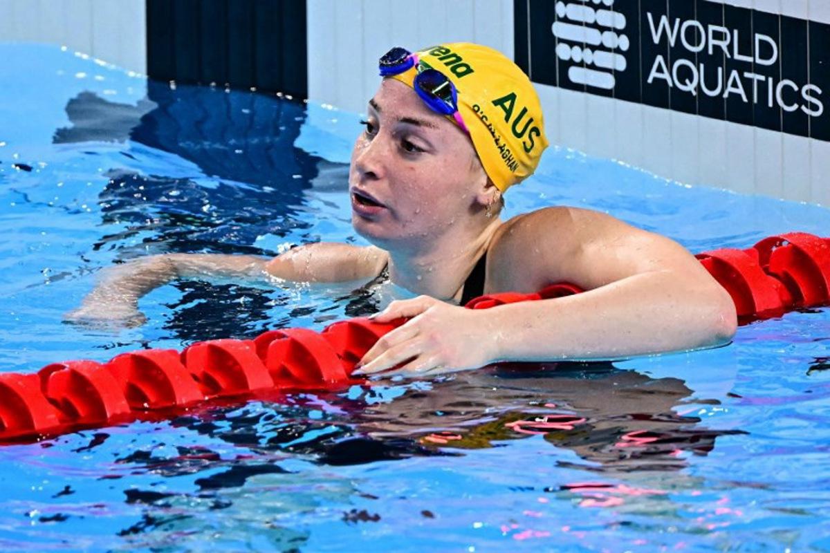 Australia's swimmer Mollie O'Callaghan reacts after competing in a semi-final of the women's 100m freestyle swimming event during the 2025 World Aquatics Championships in Singapore on July 31, 2025.  MANAN VATSYAYANA / AFP