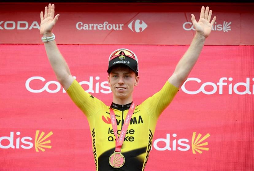 Team Visma-Lease a bike's British rider Matthew Brennan celebrates on the podium after winning the 11th stage of the Vuelta a Espana 2026 cycling tour, a 151,3 km race between Carthagena and Lorca, on September 2, 2026.  JOSE JORDAN / AFP