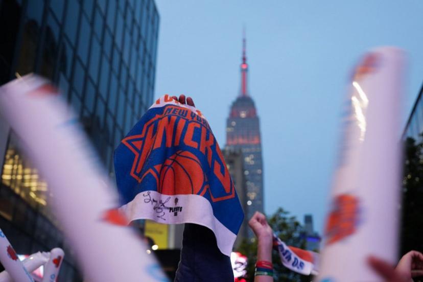 New York Knicks fans watch game 6 of the NBA playoffs against the reigning champions Boston Celtics during a watch party outside Madison Square Garden in New York on May 16, 2025.  Leonardo Munoz / AFP