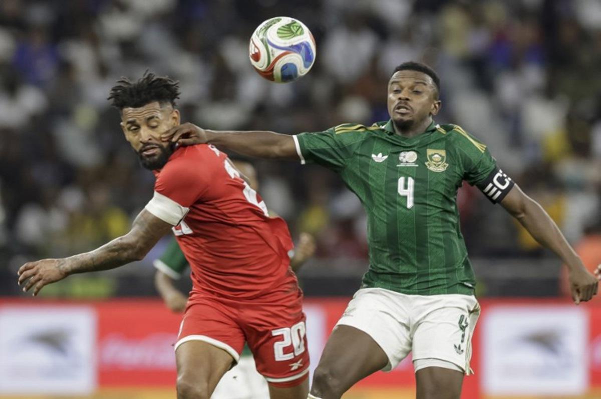 Panama's midfielder #20 Anibal Godoy fights for the ball with South Africa's midfielder #4 Teboho Mokoena during the friendly international football match between South Africa and Panama at the Cape Town Stadium in Cape Town on March 31, 2026.  GIANLUIGI GUERCIA / AFP