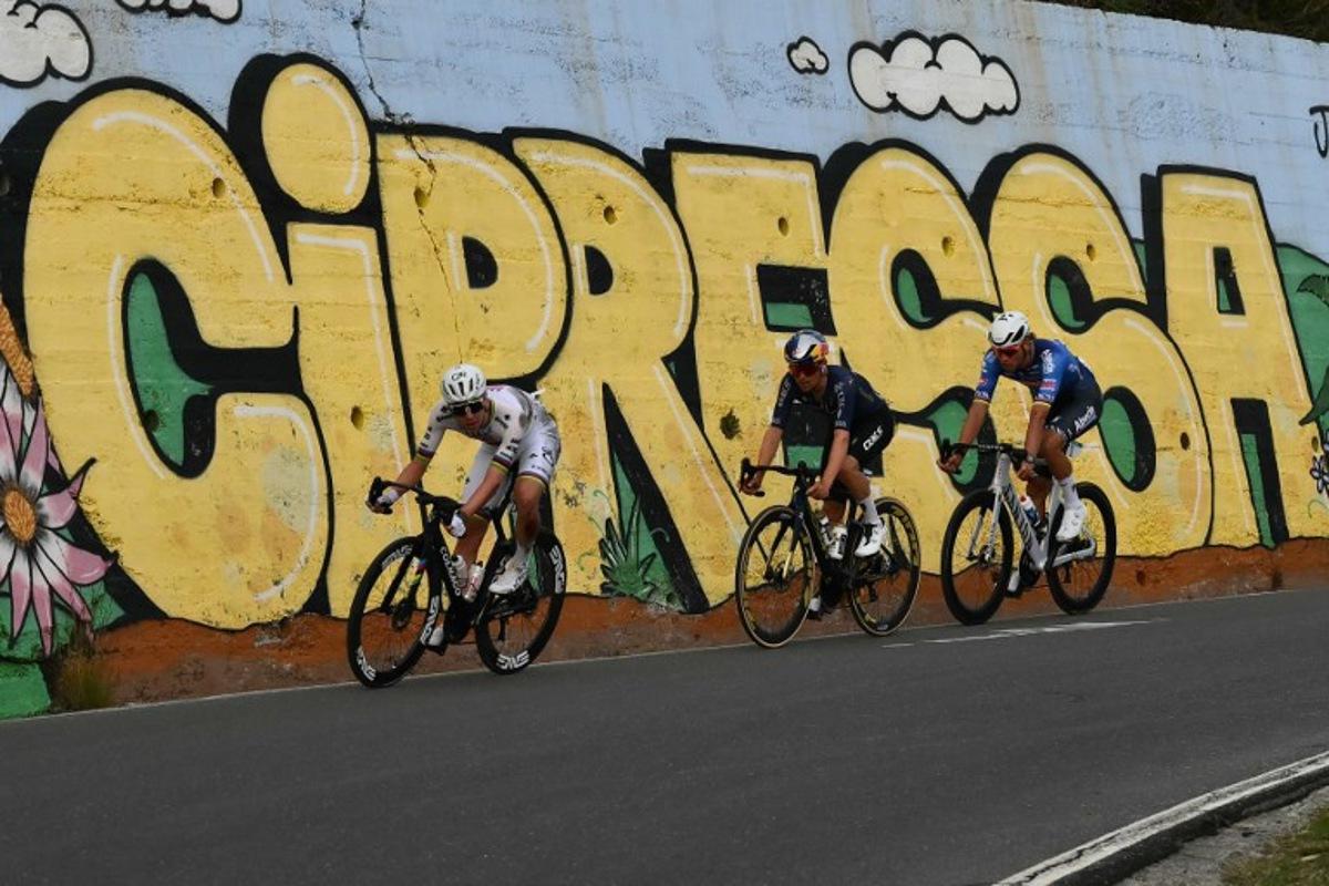 UAE Team Emirate's Slovenian rider Tadej Pogacar (L), Q36.5 Pro Cycling team's British rider Thomas Pidcock (C) and Alpecin-Deceuninck's Dutch rider Mathieu van der Poel ride down the Cipressa during the 117th Milan - Sanremo one-day classic cycling race, on March 21, 2026.  Marco BERTORELLO / AFP