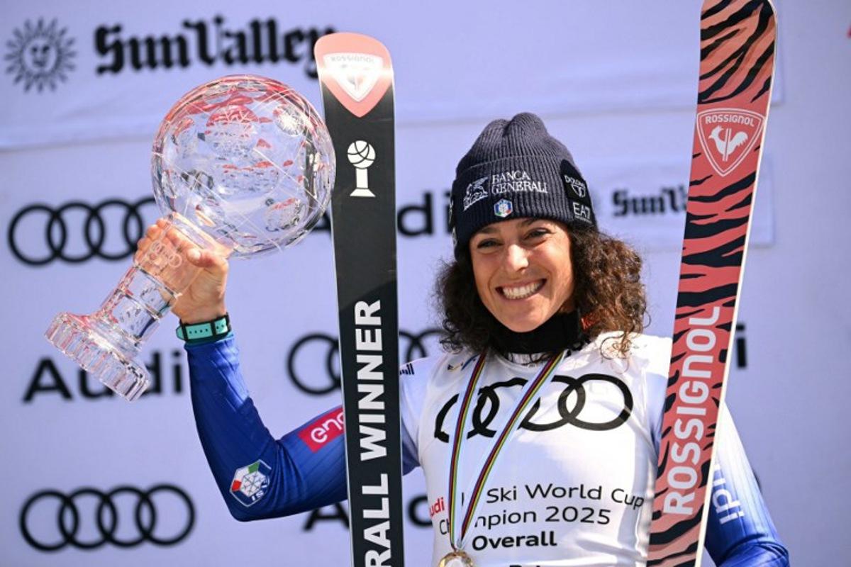 Women's overall winner Federica Brignone celebrates with the crystal globe on the podium at the 2025 FIS Alpine World Cup Finals at Sun Valley Resort in Sun Valley, Idaho, on March 27, 2025.  Patrick T. Fallon / AFP