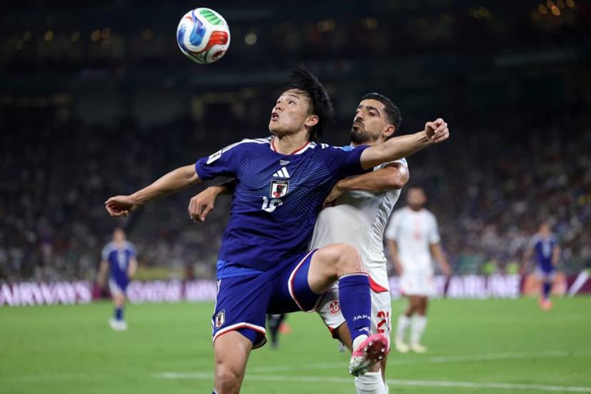 Japan's forward #18 Ayase Ueda and Tunisia's defender #21 Mohamed Ben Hamida fight for the ball during the 2026 World Cup Group F football match between Tunisia and Japan at the Monterrey Stadium in Guadalupe, Mexico, on June 20, 2026.   Julio Cesar AGUILAR / AFP