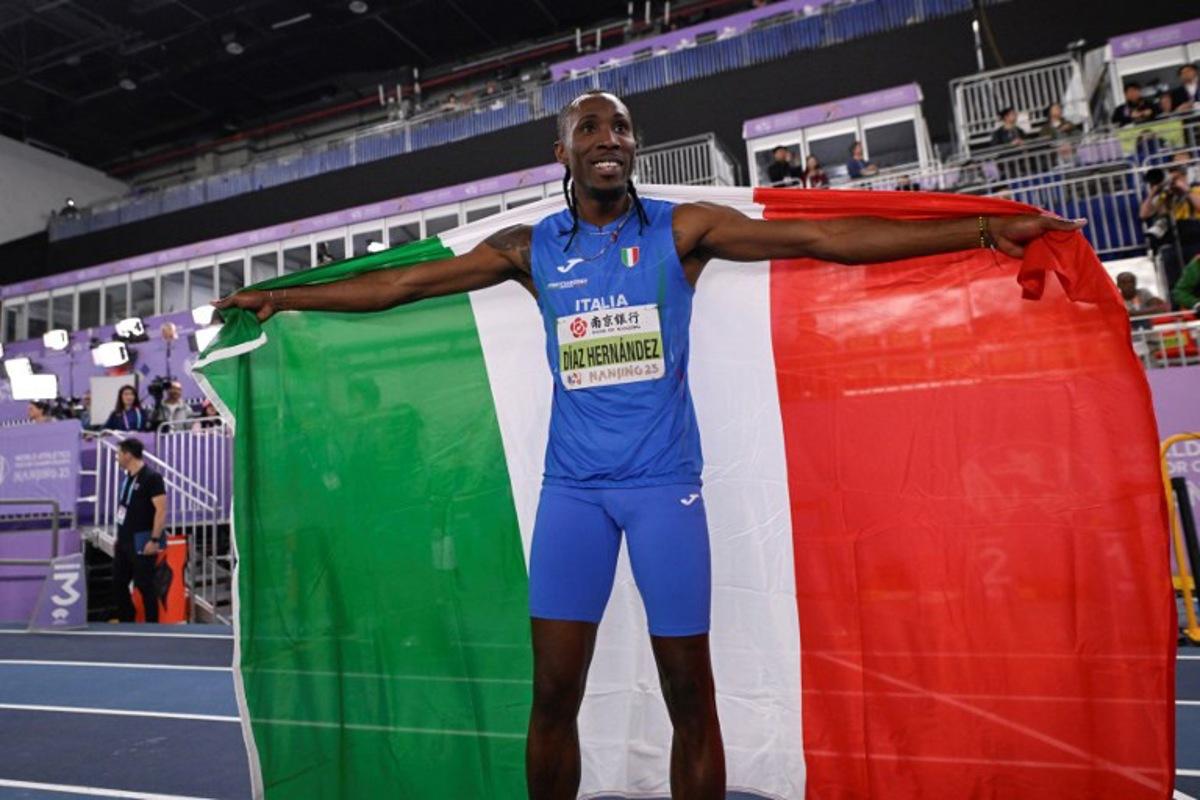 Italy's Andy Diaz Hernandez celebrates after winning the men's triple jump final during the Indoor World Athletics Championships in Nanjing, in eastern China's Jiangsu province, on March 21, 2025.  WANG Zhao / AFP