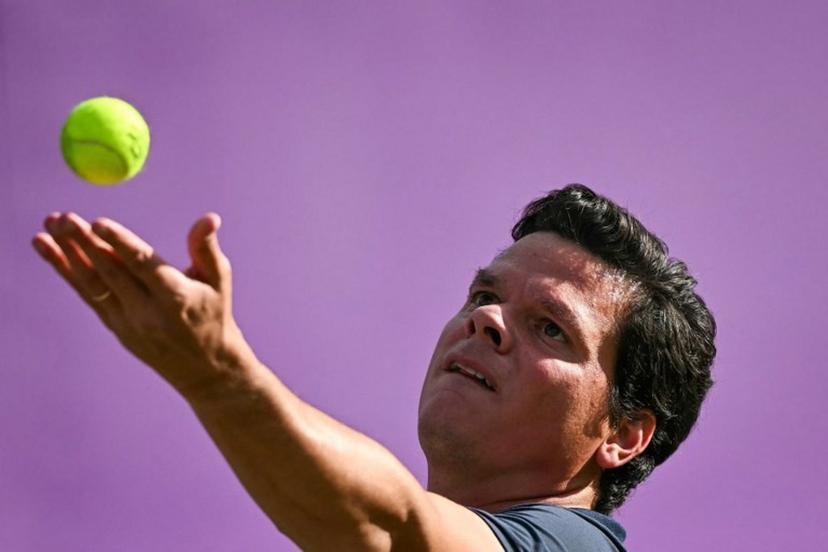 Canada's Milos Raonic serves against US player Taylor Fritz during their men's singles round of 16 match at the Cinch ATP tennis Championships at Queen's Club in west London on June 19, 2024.  Ben Stansall / AFP