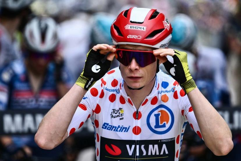 Team Visma - Lease a bike team's Danish rider Jonas Vingegaard wearing the best climber's polka dot (dotted) jersey awaits the start of the 21st and final stage of the 112th edition of the Tour de France cycling race, 132.3 km between Mantes-la-Ville and Paris Champs-Elysees Avenue, on July 27, 2025.  Marco BERTORELLO / AFP