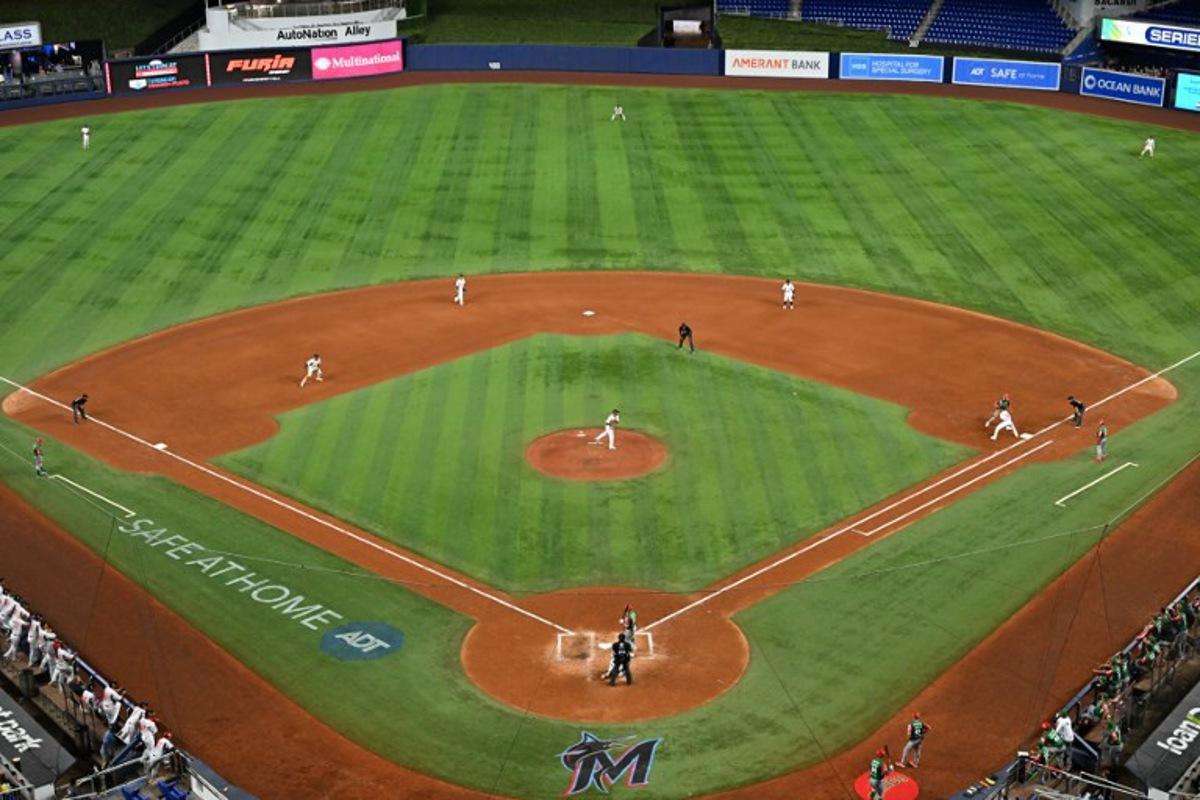 Panama's pitcher #24 Kenny Hernadez throws the ball to first base during the Caribbean Series baseball game between Mexico and Panama at LoanDepot Park in Miami, Florida, on February 3, 2024.  Chandan Khanna / AFP