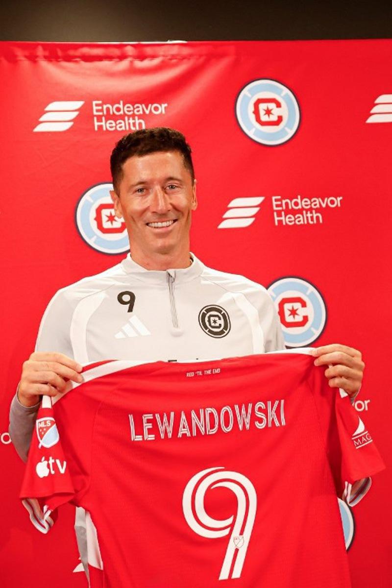 Polish forward #09 Robert Lewandowski is officially introduced during the press conference as a new member of the Chicago Fire FC at Endeavor Health Performance Center ahead of his MLS debut in Chicago, Illinois, on July 14 2026. Poland's all-time leading goal scorer Robert Lewandowski has signed a contract through the 2027-28 campaign with the Chicago Fire, the Major League Soccer club announced in late June 2026. The 37-year-old striker arrives from Barcelona after helping the Spanish giants capture the La Liga crown last month having starred from 2014-2022 with Bayern Munich.  KAMIL KRZACZYNSKI / AFP