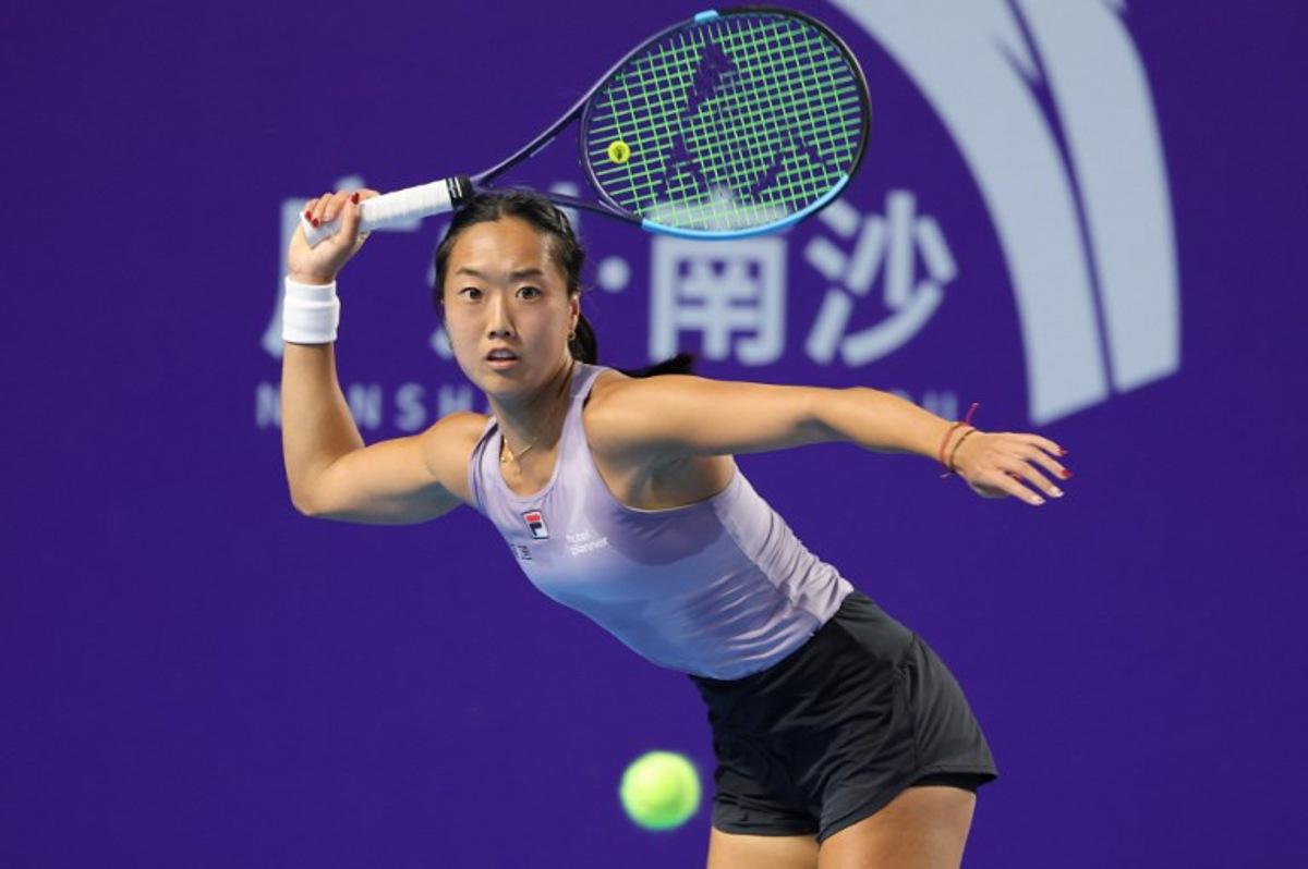 USA's Ann Li hits a return to Italy's Elisabetta Cocciaretto during their women's singles quarter-final match at the Guangzhou Open tennis tournament in Guangzhou, China's southern Guangdong province on October 24, 2025.  -STR / AFP