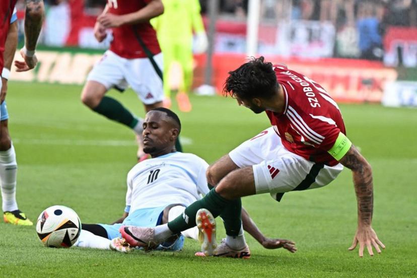 Hungary's midfielder #10 Dominik Szoboszlai (R) and Israel's midfielder #10 Gizacho Gadi Kinda vie for the ball during the International friendly football match between Hungary and Israel in Debrecen, on June 8, 2024.  Attila KISBENEDEK / AFP