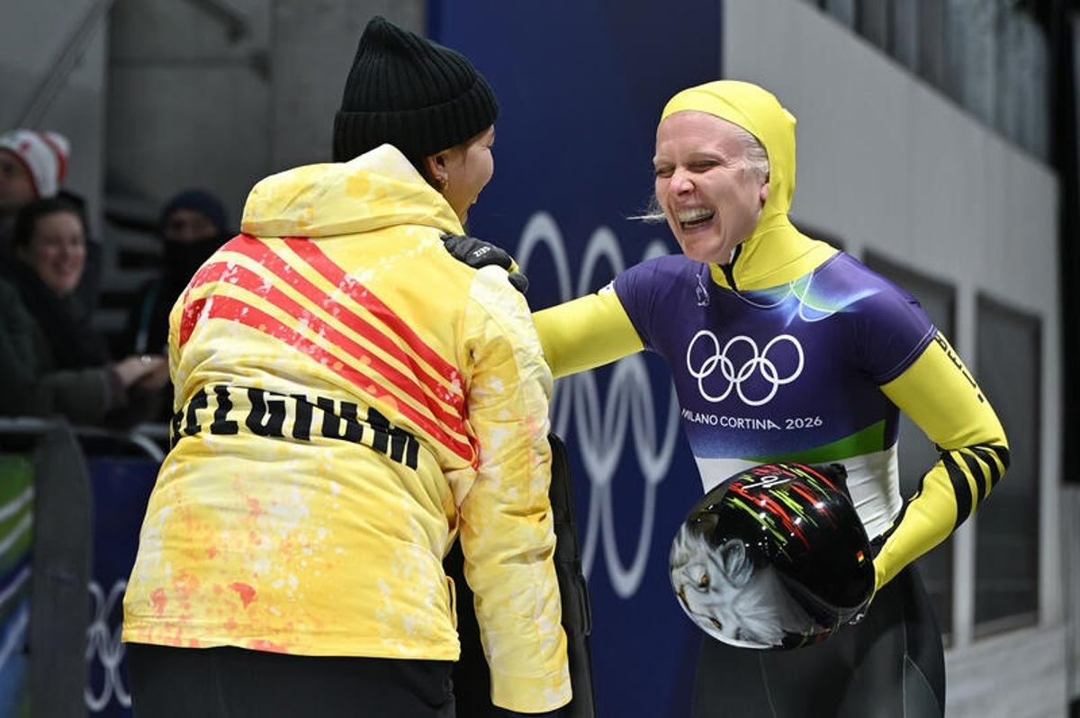 Kim Meylemans (r) of Belgium reacts after completing a run in the Women's Skeleton Heat 3 on day eight of the Milano Cortina 2026 Winter Olympic Games at Cortina Sliding Centre, Cortina d'Aprezzo, Italy, February 14, 2026. (Photo by Anthony Behar/Sipa USA) BELGIUM ONLY