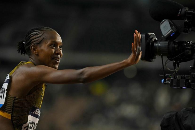 Kenya's Faith Kipyegon celebrates after winning the Women's 1500m final of the Memorial Van Damme Diamond League athletics finals at the Roi Baudouin Stadium in Brussels on September 14, 2024.  NICOLAS TUCAT / AFP