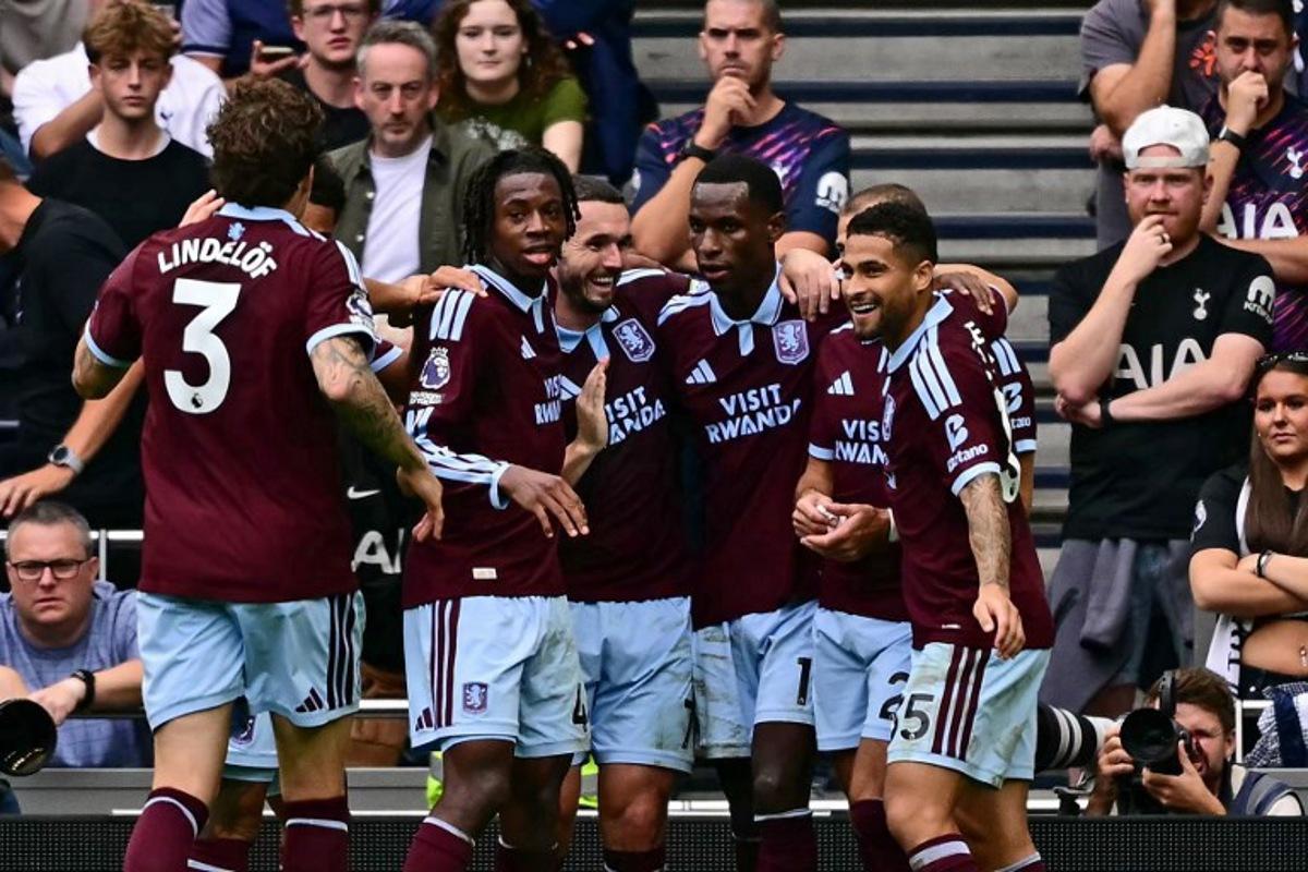 Aston Villa's Senegalese striker #11 Nicolas Jackson (C) celebrates with teammates after scoring their second goal during the English Premier League football match between Tottenham Hotspur and Aston Villa at the Tottenham Hotspur Stadium in London, on September 19, 2026.  Ben STANSALL / AFP