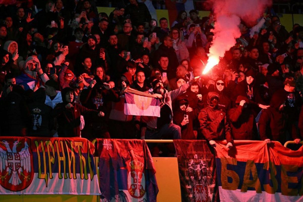 Serbian fans light flares during the UEFA Nations League play-off, first-leg football match Austria v Serbia at the Ernst Happel Stadium in Vienna on March 20, 2025.   Joe Klamar / AFP