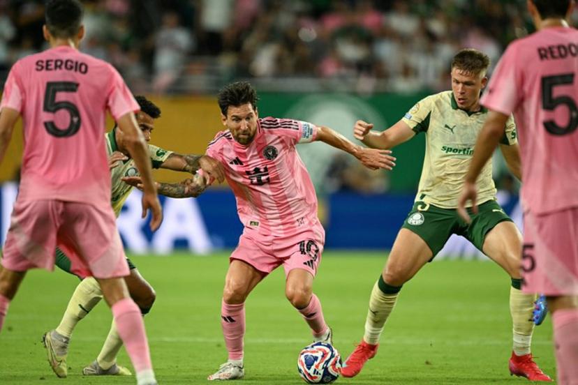 Inter Miami's Argentine forward #10 Lionel Messi (C) fights for the ball with Palmeiras' Brazilian midfielder #30 Lucas Evangelista (2nd L) and Palmeiras' Brazilian defender #03 Bruno Fuchs (2nd R) during the FIFA Club World Cup 2025 Group A football match between US Inter Miami and Brazil's Palmeiras at the Hard Rock stadium in Miami on June 23, 2025.  CHANDAN KHANNA / AFP