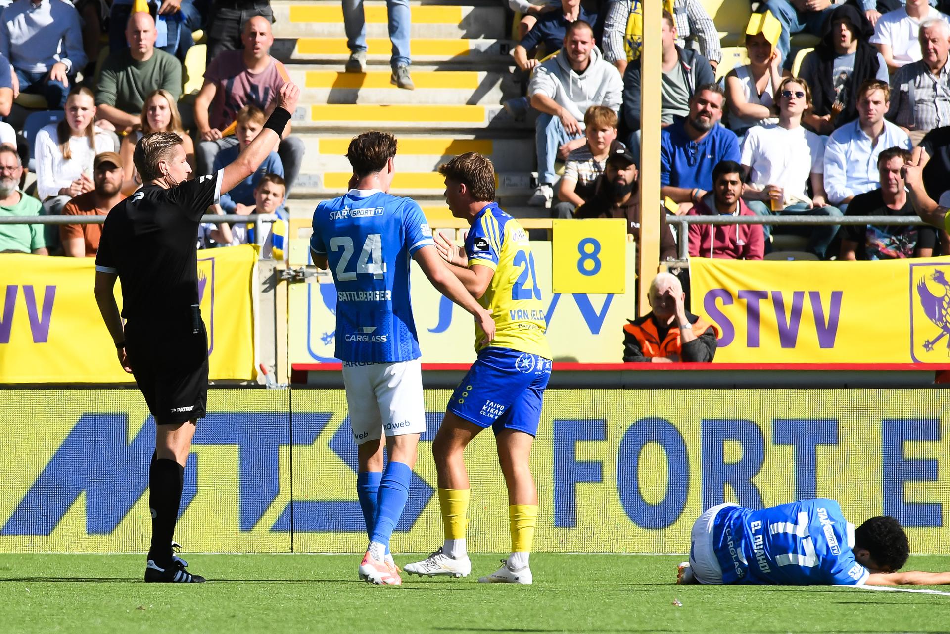 STVV's Rein Van Helden receives a red card from, referee Lawrence Visser and during a soccer match between Sint-Truidense V.V. and KRC Genk, Sunday 28 September 2025 in Sint-Truiden, on day 9 of the 2025-2026 'Jupiler Pro League' first division of the Belgian championship. BELGA PHOTO JILL DELSAUX