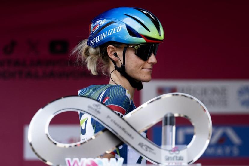 AG Insurance-Soudal's Slovenian cyclist Urska Zigart walks past the Giro d'Italia trophy ("trofeo luce infinita") during the pre-stage presentation ahead of the 9th stage of the Giro d'Italia Women 2026 between Saluzzo and Saluzzo in Saluzzo on June 7, 2026.  MARCO BERTORELLO / AFP