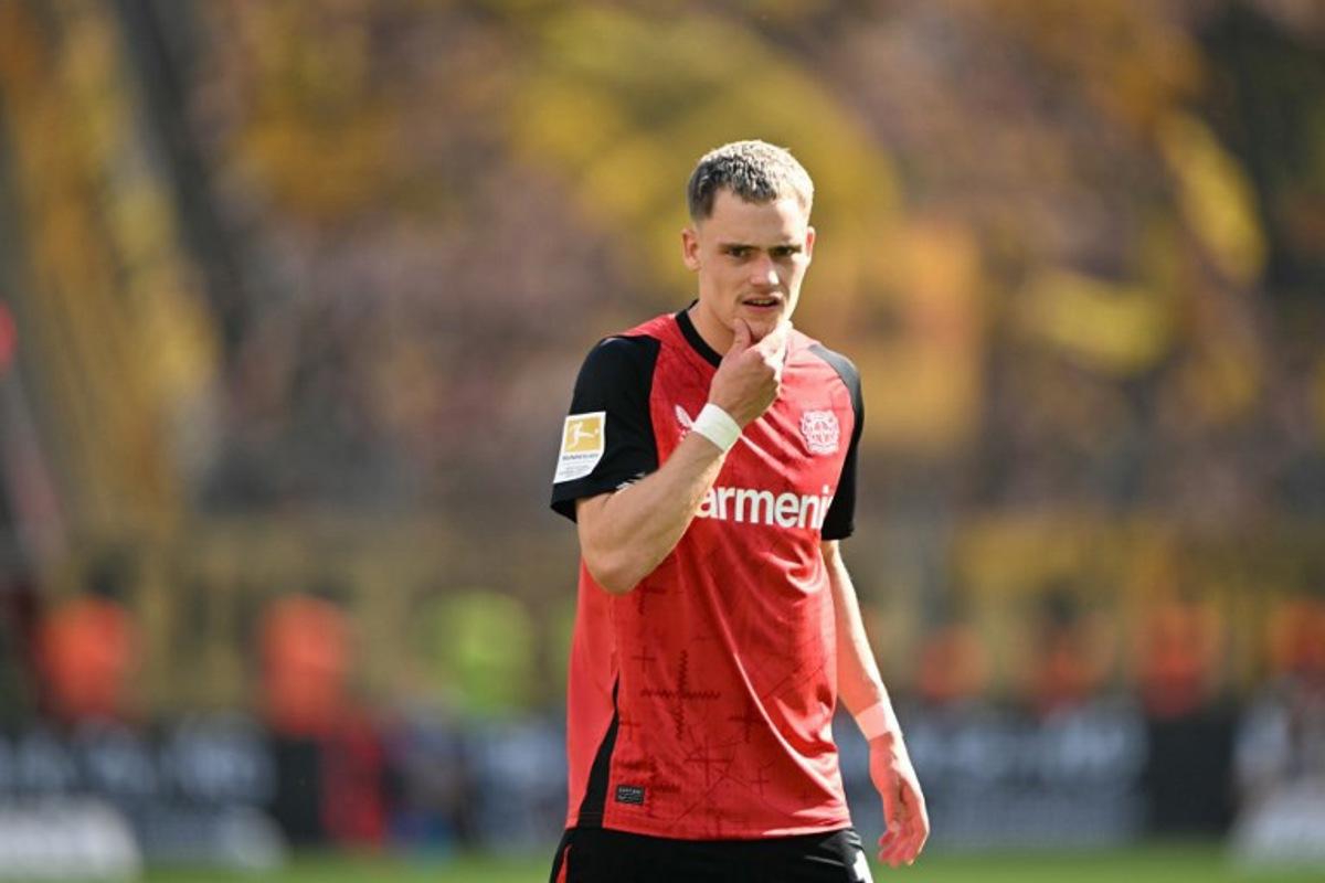 Bayer Leverkusen's German midfielder #10 Florian Wirtz reacts during the German first division Bundesliga football match between Bayer 04 Leverkusen and Borussia Dortmund in Leverkusen, western Germany, on May 11, 2025.  INA FASSBENDER / AFP