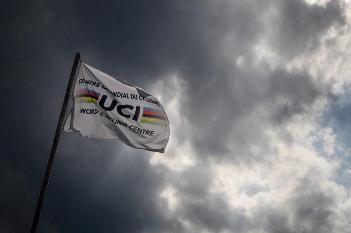 This photo taken on August 10, 2020, shows a flag of the UCI (International Cycling Union) floating under heavy clouds next to the headquarters of the world's cycling governing body in Aigle amid the COVID-19 outbreak, caused by the novel coronavirus. The cycling world championships scheduled for Aigle-Martigny in Switzerland on September 20-27, 2020, might be called off due to local health rules organisers warned on August 7. Swiss federal authorities are due to examine their rules on August 12, and may ban sports gatherings involving more than 1,000 people. Fabrice COFFRINI / AFP
